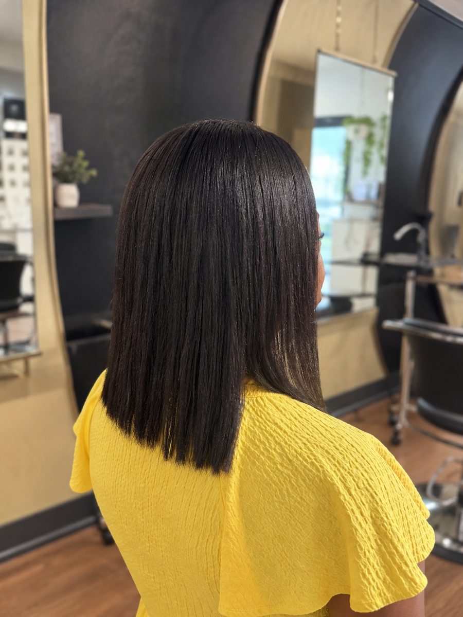 After a Japanese permanent straightener: sleek, straight shoulder-length hair on the same client at Eutopia Salon in Baton Rouge